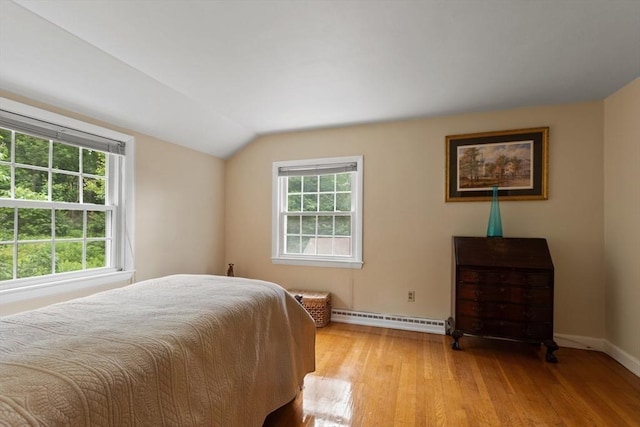 124 Hillside Rd, North Andover, MA 01845 - bedroom featuring baseboard heating, light wood finished floors, and lofted ceiling