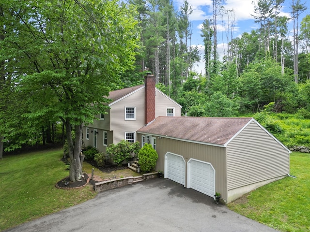 124 Hillside Rd, North Andover, MA 01845 - view of home's exterior featuring a lawn, roof with shingles, driveway, and an attached garage