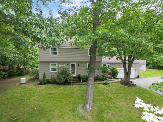 124 Hillside Rd, North Andover, MA 01845 - colonial house featuring asphalt driveway, a garage, and a front yard