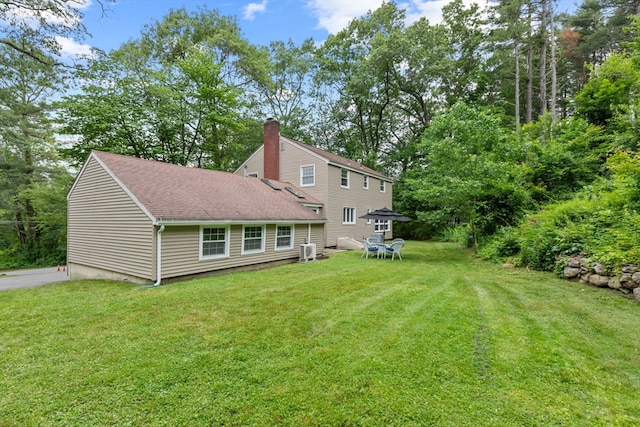 124 Hillside Rd, North Andover, MA 01845 - back of property featuring a yard, a chimney, and roof with shingles