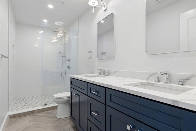 18-20 Parkman St Unit 5, Boston, MA 02122 - full bath featuring a tile shower, double vanity, a sink, and toilet