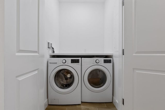 18-20 Parkman St Unit 5, Boston, MA 02122 - laundry room with laundry area, wood finish floors, and washer and dryer