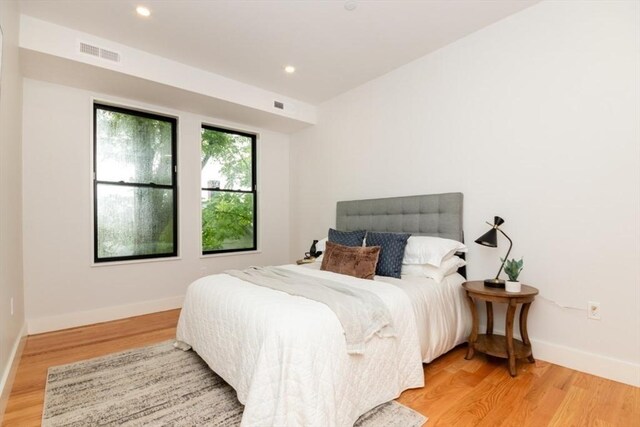 18-20 Parkman St Unit 5, Boston, MA 02122 - bedroom with light wood-style flooring, recessed lighting, visible vents, and baseboards