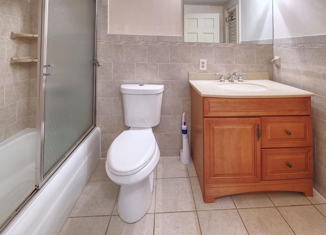 175 Knotty Pine Ln, Barnstable, MA 02632 - full bathroom featuring tile walls, toilet, vanity, shower / bath combination with glass door, and tile patterned floors