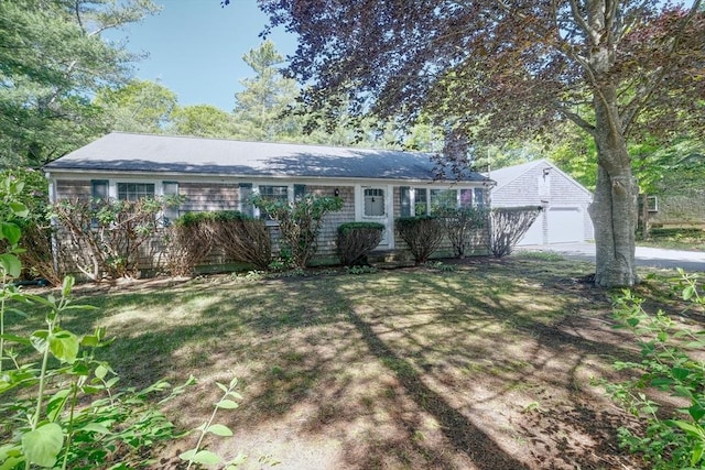 175 Knotty Pine Ln, Barnstable, MA 02632 - ranch-style house featuring a garage, concrete driveway, an outdoor structure, a chimney, and a front lawn