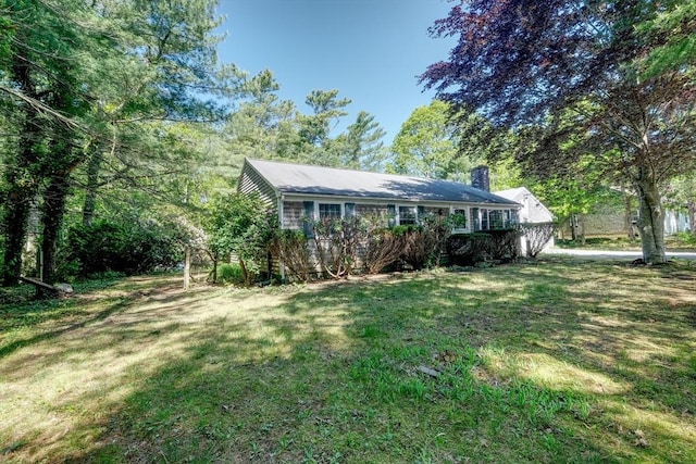 175 Knotty Pine Ln, Barnstable, MA 02632 - view of front facade with a front lawn and a chimney