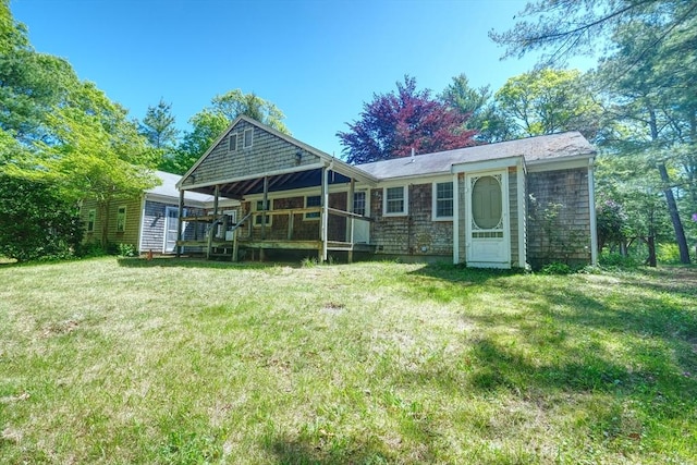 175 Knotty Pine Ln, Barnstable, MA 02632 - rear view of house with a yard