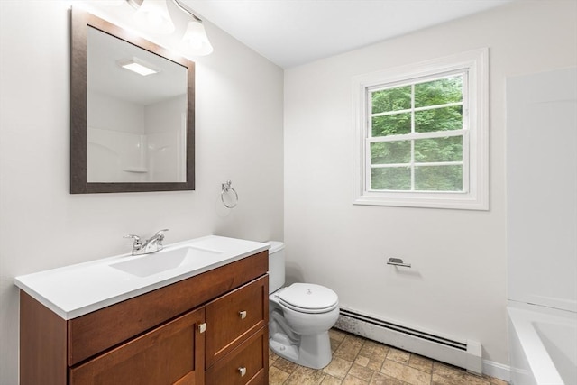 bathroom featuring baseboard heating, toilet, and vanity