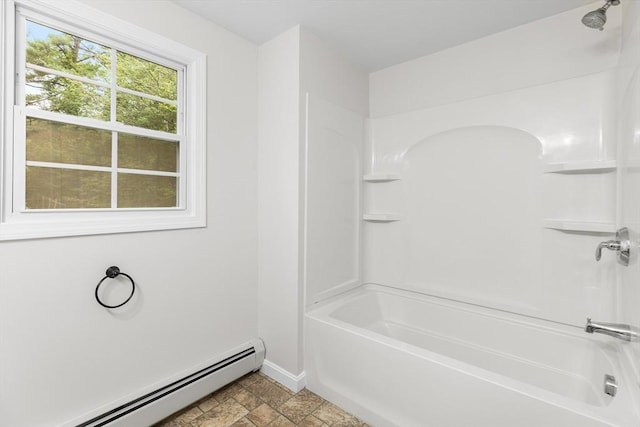 bathroom featuring baseboard heating and washtub / shower combination