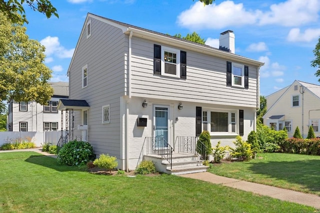 85 Loring Ave, Winchester, MA 01890 - colonial house with a chimney and brick siding