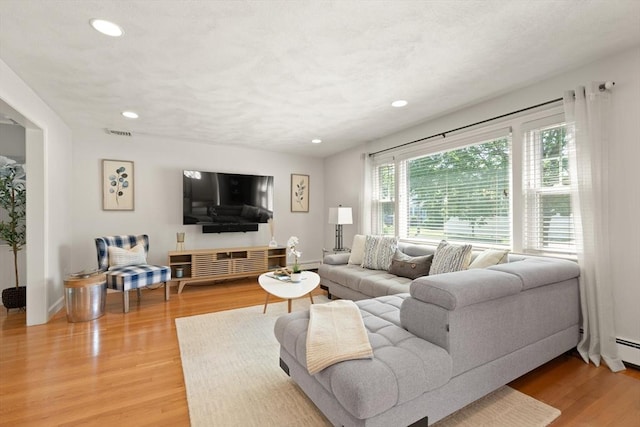 85 Loring Ave, Winchester, MA 01890 - living room with light wood-style floors and recessed lighting