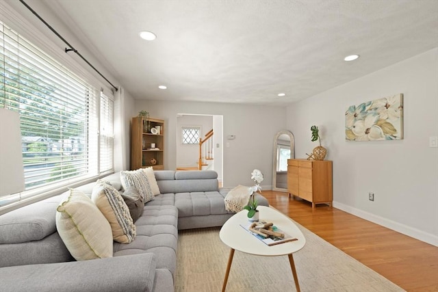 85 Loring Ave, Winchester, MA 01890 - living room with stairway, wood finished floors, and recessed lighting