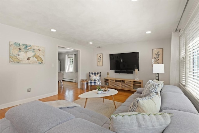 85 Loring Ave, Winchester, MA 01890 - living room featuring healthy amount of natural light, a baseboard radiator, wood finished floors, and recessed lighting