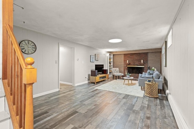 85 Loring Ave, Winchester, MA 01890 - living area featuring wood finished floors and a fireplace