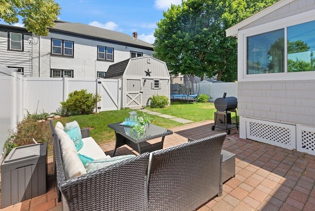 85 Loring Ave, Winchester, MA 01890 - fenced backyard with a patio area, a shed, a trampoline, outdoor lounge area, and grilling area