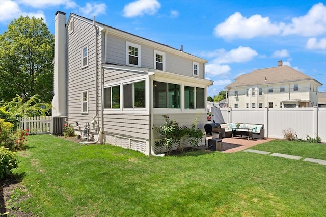 85 Loring Ave, Winchester, MA 01890 - rear view of house featuring outdoor lounge area, a fenced backyard, a chimney, and a patio