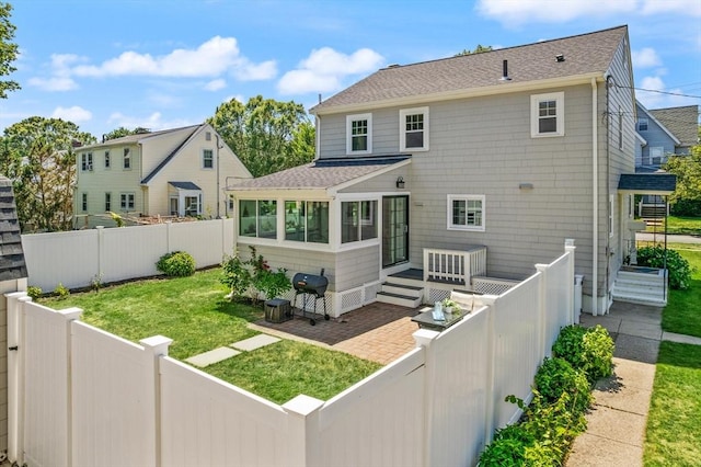 85 Loring Ave, Winchester, MA 01890 - back of house featuring a fenced backyard, roof with shingles, and a sunroom