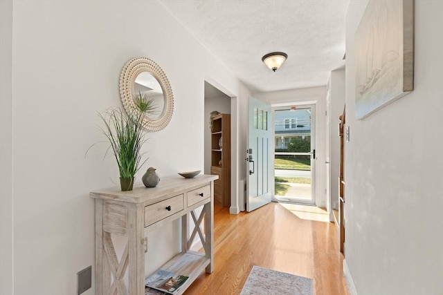 85 Loring Ave, Winchester, MA 01890 - doorway to outside featuring light wood-style floors