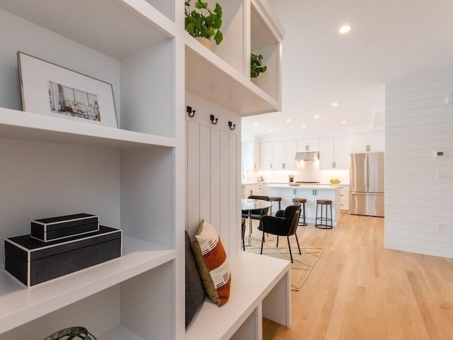 mudroom with light hardwood / wood-style floors