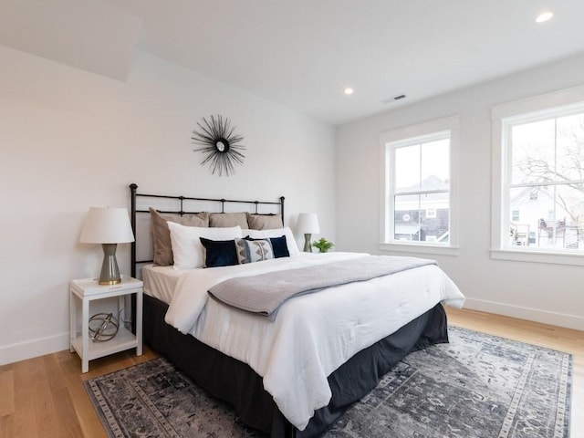 bedroom with wood-type flooring