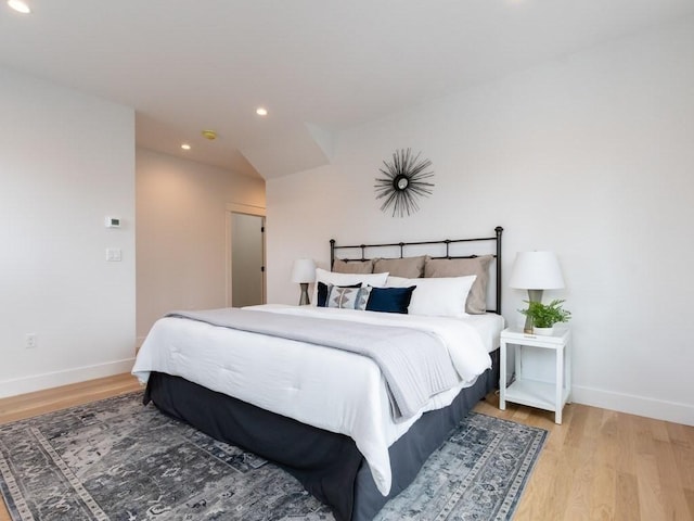 bedroom with hardwood / wood-style flooring