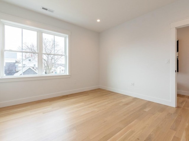 empty room with light hardwood / wood-style floors