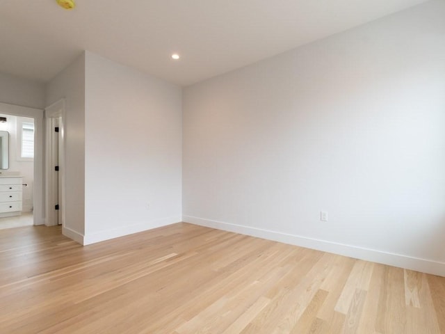 spare room featuring light wood-type flooring