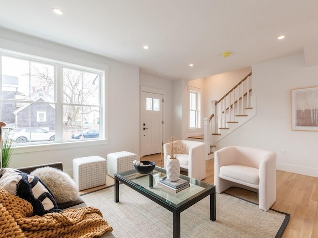 living room with light hardwood / wood-style flooring