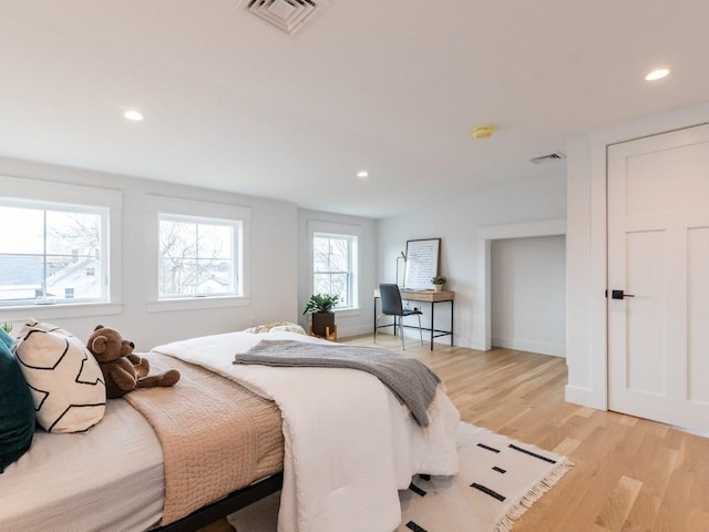 bedroom with light hardwood / wood-style flooring