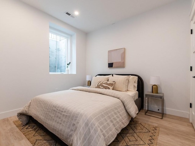 bedroom featuring light hardwood / wood-style flooring