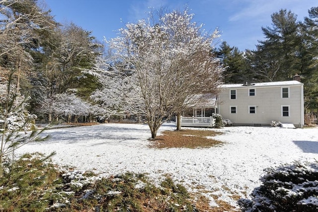 view of yard layered in snow