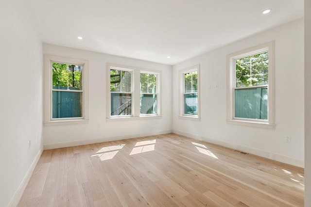 8 Holly Ave Unit 1, Cambridge, MA 02138 - spare room featuring light wood finished floors, baseboards, and recessed lighting