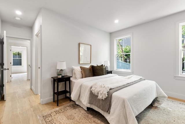 8 Holly Ave Unit 1, Cambridge, MA 02138 - bedroom with light wood-style flooring, baseboards, and recessed lighting