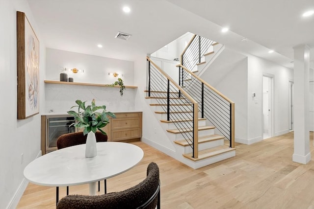 8 Holly Ave Unit 1, Cambridge, MA 02138 - dining area with baseboards, light wood-style floors, stairway, recessed lighting, and a bar