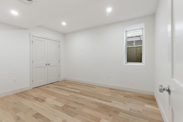 8 Holly Ave Unit 1, Cambridge, MA 02138 - unfurnished bedroom with light wood-style flooring, baseboards, and recessed lighting