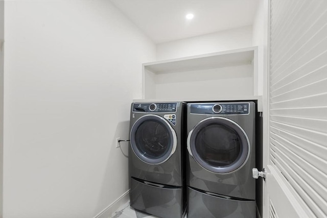 8 Holly Ave Unit 1, Cambridge, MA 02138 - laundry area featuring washing machine and dryer, baseboards, and marble finish flooring