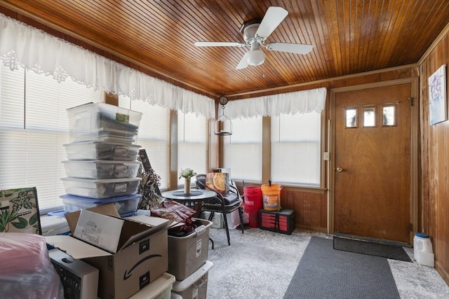 sunroom with wood ceiling and ceiling fan