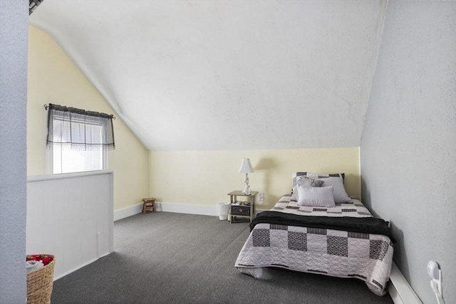 bedroom featuring carpet and vaulted ceiling