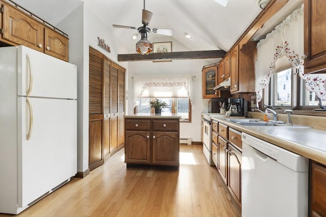 kitchen featuring light wood-type flooring, under cabinet range hood, a baseboard heating unit, a sink, and white appliances