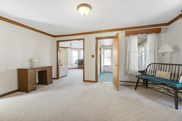 living area with crown molding, light colored carpet, and baseboards