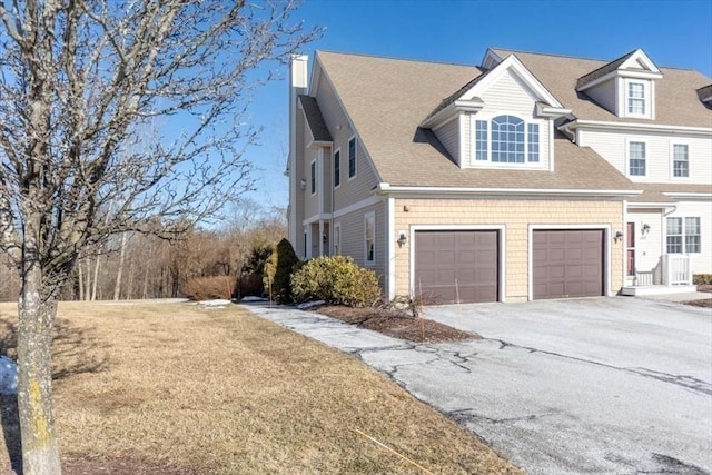 view of side of property featuring a garage