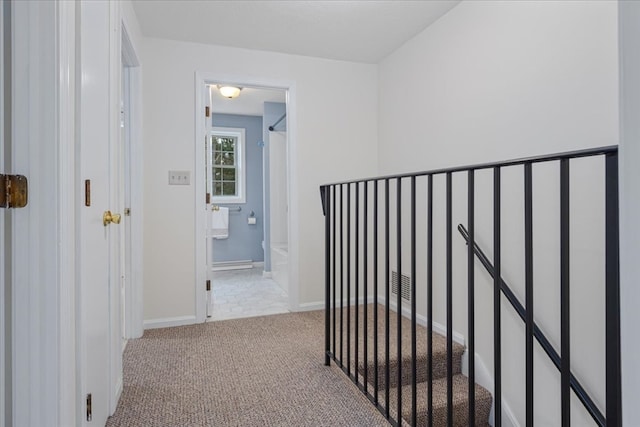 corridor with light colored carpet