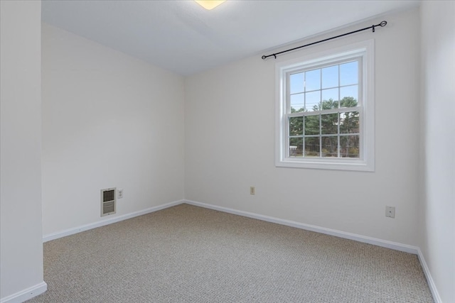 unfurnished room featuring carpet flooring