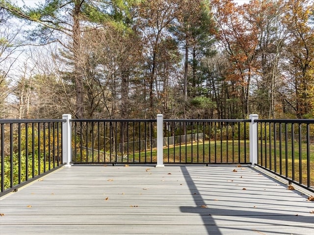 wooden deck with a yard