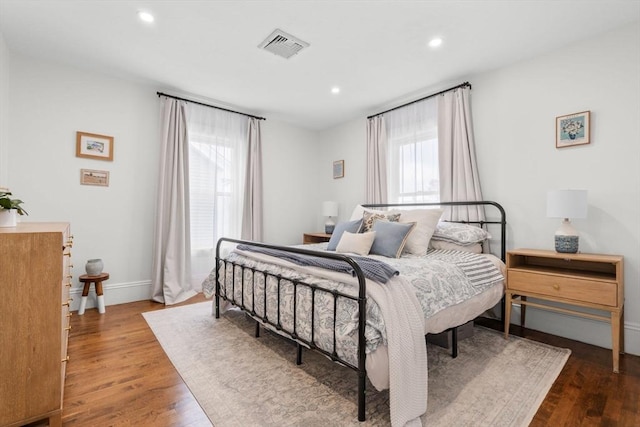 bedroom with hardwood / wood-style flooring