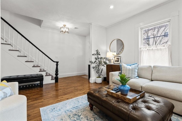 living room with ornamental molding and dark hardwood / wood-style flooring