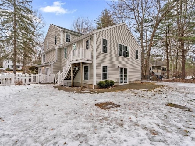 view of front of home featuring fence