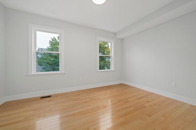 unfurnished room with light hardwood / wood-style floors