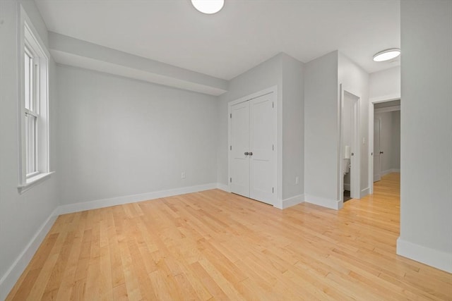 spare room with light hardwood / wood-style floors