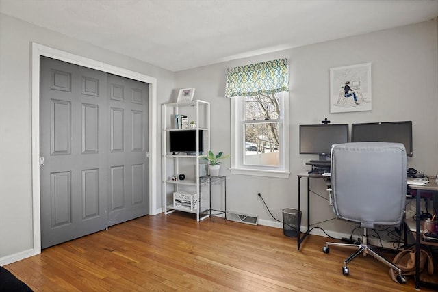 home office featuring light hardwood / wood-style flooring